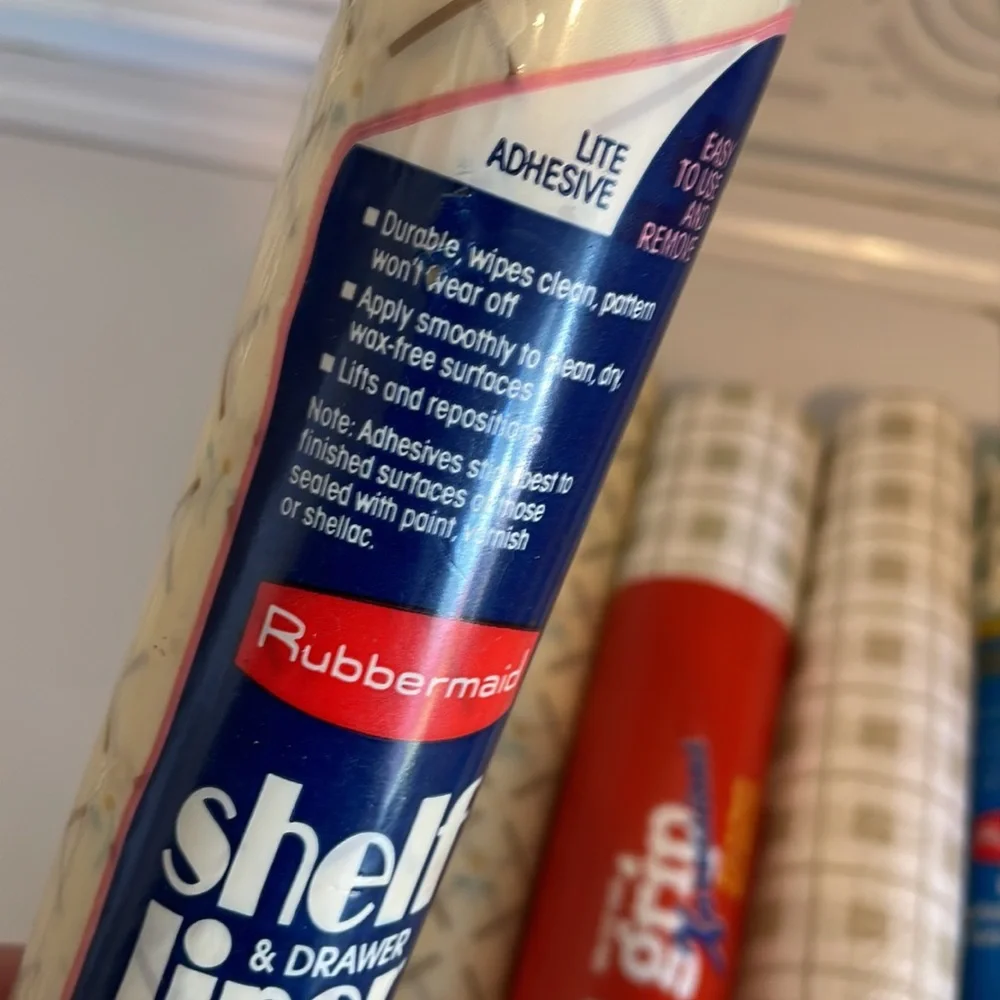 Five rolls of Rubbermaid shelf liner, some adhesive some not 3 full new rolls